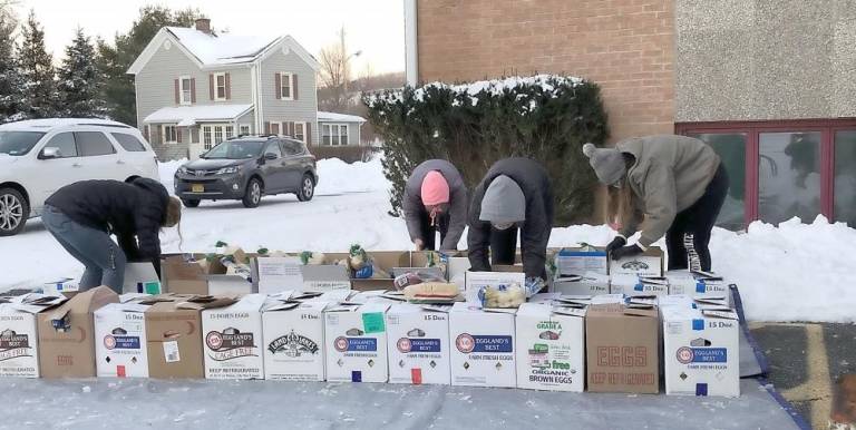 The second box was fully packed the day of the distribution. Both boxes were packed outside by the Girl Scouts and, in a couple of instances, at temperatures in the single and low double digits.