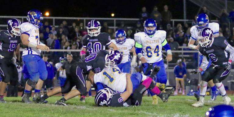 Crusaders Owen Chambers (#20) and Kyle Strauss (#8) haul Washingtonville QB Sean Dunnigan to the ground.