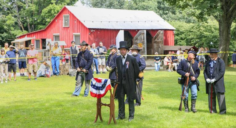 A reenactor portraiting President Lincoln delivers the Gettysburg Address.
