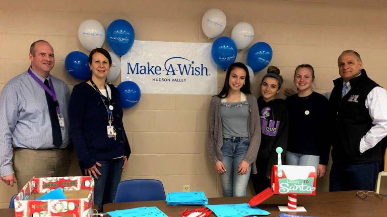 Provided photos Pictured from left to right: Monroe-Woodbury High School Assistant Principal John Flanagan, Club Advisor Holly Martucci, students Emma Herbst, Cate Armstrong and Emily Martucci and Town of Monroe Supervisor Tony Cardone.