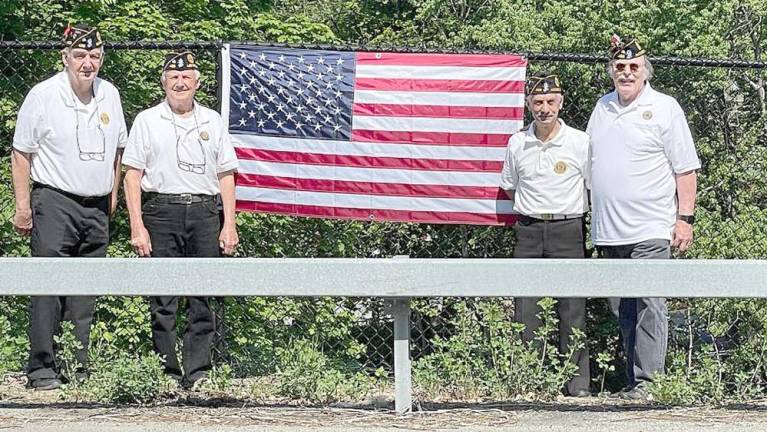 Marty Currid, left, Kurt Haugh, Oscar Giusto and Jack Collins of American Legion Post 488 have been maintaining area flags and educating the community about the U.S. flag and flag etiquette for 10 years.