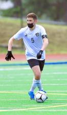 Co-captain Ethan Meyers moves the ball up the field. Photos by William Dimmit.