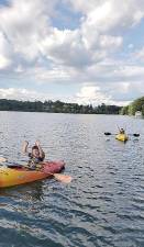 Ziggy Burston of Monroe and his visiting cousin Avremmy Young,of Buffalo did a combination of kayaking and paddle-boarding on Walton Lake to reach their six-mile fund-raising goal. Their campaign entitled “Cousins for a Cause” raised $1,600 for the charity Chai-Life-Line. Provided photo.