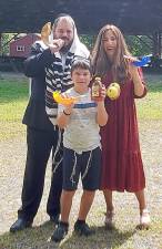 Rabbi Pesach and Chana Burston, pictured with their son Ziggy in front of the giant outdoor pavilion at Rosmarin’s in Monroe, will lead a variety of High Holiday Services for adults, children and families. All services will be held outdoors. The family service will feature the practice of the holiday highlights including Shofar (ram’s horn) and apples dipped in honey. Photos courtesy of Chabad of Orange County.