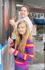 Jessica Kiesel and Rebecca Pomerantz were among the members of National Art Honor Society of Monroe-Woodbury High School who painted windows in the Village of Monroe for the Halloween seasons.
