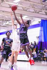 Jayden Desir, #1, glides to the basket in the fourth quarter.