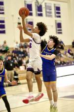 Jankarlos Mendoza, #40, gets an hand in face on his way to the basket.