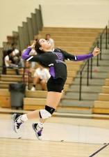 Jordan Ader (#15) unleashes one of her ferocious serves.