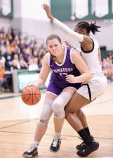 Monroe-Woodbury center Arianna Exarchakis muscles her way past a White Plains High School defender early in the New York State Regional Championship in Yorktown on March 11, 2023.