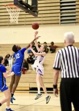 Crusader Fallon Durkin (in white) scored 12 points in M-W 51-40 win over Wallkill.