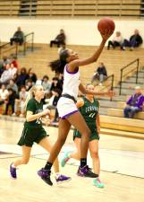 Zoe Hudson (#21) glides down the lane for 2 in the first quarter.