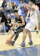 Josh Castro swings around a Wizard defender on his way to the basket in the fourth quarter.