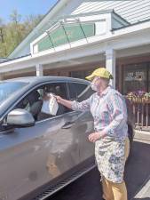 Jen Jenkins makes a curbside delivery for a customer of Dottie Audrey’s Bakery/Kitchen in Tuxedo.