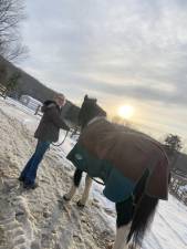 Madeline Williams with a therapy horse at Winslow Therapeutic Riding Center in Warwick