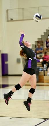 Senior Co-captain Payton Grove serves in Monroe-Woodbury’s first game of the 2023 varsity volleyball season against Washingtonville. Photos by William Dimmit.