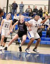 Kelsey O’Brien fights for position under the boards in the first half.