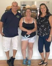 Artyxs Cafe owner, Sheri Cook (center) with Town of Monroe Councilman Sal Scancarello and Village of Monroe Trustee Dorey Houle.