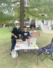 Village of Monroe resident Junior Arius said he wanted to share some good news among the negative press that police are getting. “Recently my son and his friend made a lemonade stand and one of our local police officers stopped by and purchased five lemonades,” the Village of Monroe resident wrote in an email exchange with The Photo News. “I just thought it was so thoughtful of her and wanted to share this with our community.” Pictured are Police Officer Melissa Berke, Oliver Arius and Jackson Spreckman.