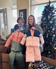 L-R: Weichert sales associate Lorraine Pisciotta and processing manager Heather Laurencell spearheaded coat and toy drives for local families in need this holiday season. Weichert’s Monroe office also raised funds for a local food pantry.