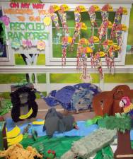 Every year the 16 classrooms at On My Way Early Learning and Childcare Center work together to create a recycled project for Earth Day to showcase the children’s art and creativity. This year, they created a Recycled Rainforest. Provided photos.