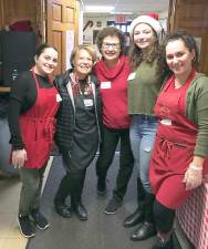 These volunteers from the 2018 Christmas dinner are again ready to ensure the 2019 dinner is a memorable one for patrons of Our Father’s Kitchen, located at the Sacred Heart Chapel on Still Road in Monroe.