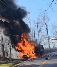 Dump truck ignites after crash with SUV