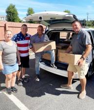 Pictured left to right: Sue and Jim Banville of Sacred Heart-St. Patrick Church, Monroe Town Councilman Sal Scancarello and Town of Monroe ZBA member Steve Thau. Provided photo.