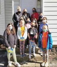 Troops representing different age levels in the Monroe-Woodbury Girl Scout Community again assisted Monroe Food Pantry organizers with the preparation of annual Thanksgiving food boxes for those in need. Provided photos.