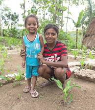 Young farmer Yabes Tefa, pictured here with her daughter, Sifralili, participates in the Timor Zero Hunger program, which is an integrated community development project to help some of Indonesia’s poorest families improve their lives. Programs such as this are among the beneficiaries of the CROP Walk, which takes place Sunday, Oct. 27, in Monroe and elsewhere across the country.