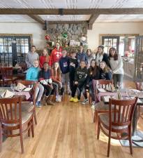 Group picture of the Monroe-Woodbury Middle School students who got together with their teachers to decorate The Tequila Grill in Monroe for the holiday season: Beginning in front, from left to right are: Olivia Cooper, Riley Teye-Mensah, Olivia Masiello, Kayla Patino, Kalin Aubry-Shea and Madelyn McCleary; in the middle, from left: Shane Golio an Giovanni DeGiglio; and in back, from left: Beth Rickli (teacher), Charlotte Bacsardi, Samya Khan, Shaheera Shaik, Emily Roy, Stephanie Rizzi (teacher) and Amy Wallace (teacher).