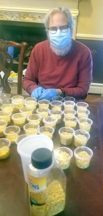 Dr. Ira Kanis of Monroe helps package soup croutons for the “Chicken Soup &amp; Challah for the Quarantined Soul” packages.