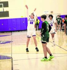 Kyle McDermott, #23, hits a 3-point shot as the buzzer sounds.