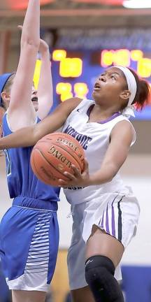 Toni Neely drives to the basket in the first quarter during last Saturday's Section 9 AA title game against Valley Central at Mount Saint Mary College in Newburgh.