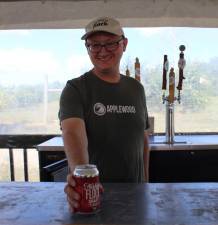 Naked Flock’s Dylan Hull behind the bar. The local cidery will be one of seven craft beverage makers pouring unlimited drinks at the Black Dirt Beer Bash Saturday, September 10 at Sugar Loaf Performing Arts Center. Photo credit: Ann Marie Vitoulis