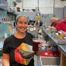 Patrons puzzle over trivia while Apex pours pints.