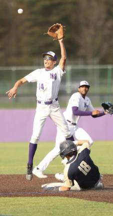 Crusader second baseman Brandon Tarasenko leaps high for throw down to second base.