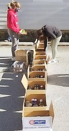 During two different preparation days, completed outside following social distancing guidelines with included required mask wearing, the girls prepped the large boxes which included all the traditional food items used in making a Thanksgiving meal, plus turkeys and homemade apple pies made by girls as part of the Girl Scouts’ annual “Operation Apple Pie” initiative.