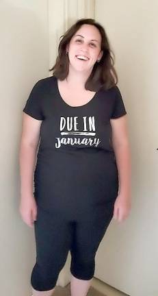 Dana Becker's T-shirt gives her due-date.