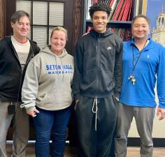 Pictured from left to right are George F. Baker Athletic Director Marco Margotta, Assistant Athletic Director Michelle Hines, George F. Baker senior Mo Berthe and Varsity Basketball Coach Matt Takeuchi. Photo provided by the Tuxedo School District.