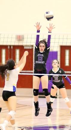 Abigail Armstrong blocks a Wizard shot.