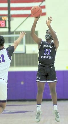 Aaron Paul (#13) gets of a jump shot early in the game.