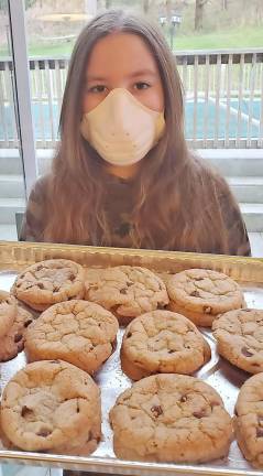 Rivkah Burston, 11, baked desserts for the “Chicken Soup &amp; Challah for the Quarantined Soul” packages.