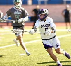 Monroe-Woodbury’s Liam Gallagher chases down a loose ball in the first half of the NYSPHSAA Sub-Regional boys lacrosse game in Middletown.