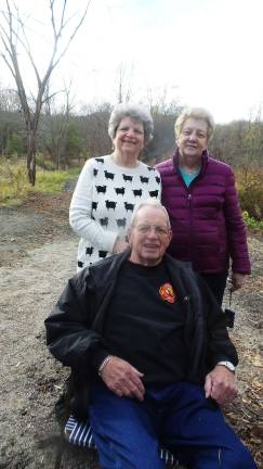 Brenda Board Burgan stands next to her mother, Nancy, and behind her father, Clarence Board. The land and the Seely Brook bridge played an important part in the life of their family (Photo by Frances Ruth Harris)