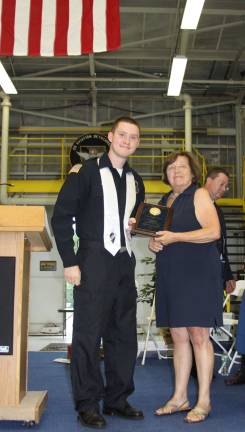 Matthew Gamb of Monroe was the recipient of the Outstanding Security Careers Academy Award and the Robert J. Hunter Memorial Scholarship. He is pictured with OU BOCES Cooperative Board member Martha Bogart.