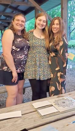 Pictured from left to right: Becky Benezra of Monroe, Sarah Wallach of Middletown and Chana Burston of Monroe enjoy a summer evening at Chabad’s Jewish Women’s Circle as they choose designs for glass etching.