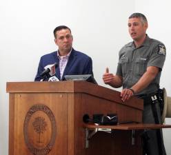Orange County Executive Steven M. Neuhaus looks on as State Police Captain Peter Cirigliano II speaks during a news conference in June at the county’s Emergency Services Center. Photo provided by Orange County.
