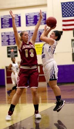 Ava Delardi (#23) drives into traffic on her way to the basket.