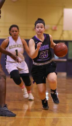 Ava Delardi (#23) drives past a Goldback defender.