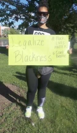 Yaribel Mercedes' sign: Legalize Blackness